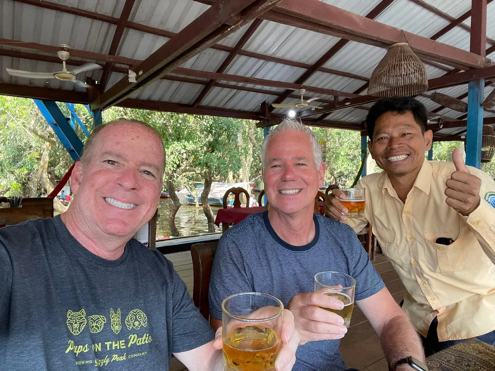 San enjoying a local lunch with two guests during the tour